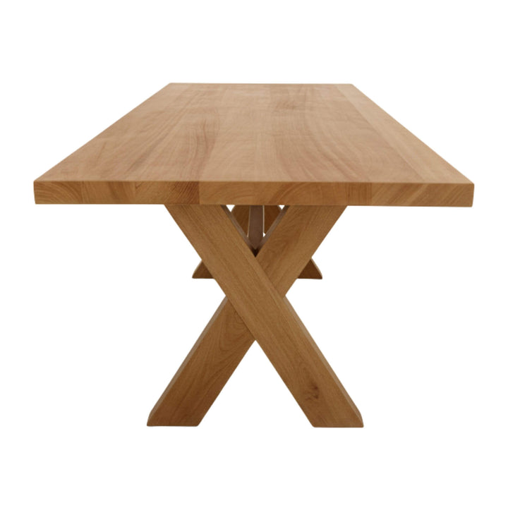 Side profile of the teak bench paired with the Santorini dining table.