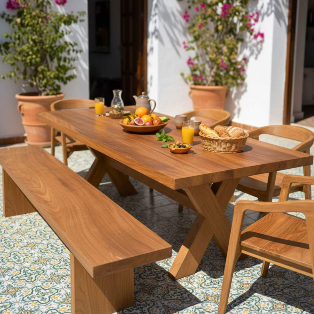 Styled outdoor dining area with the Santorini table set for a meal.