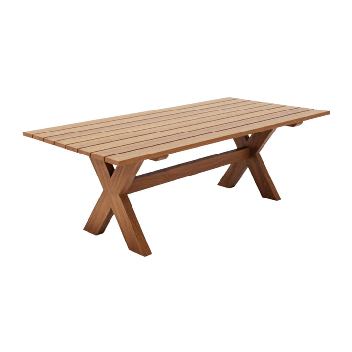 Front view of the Santorini outdoor dining table in teak with X-legs.