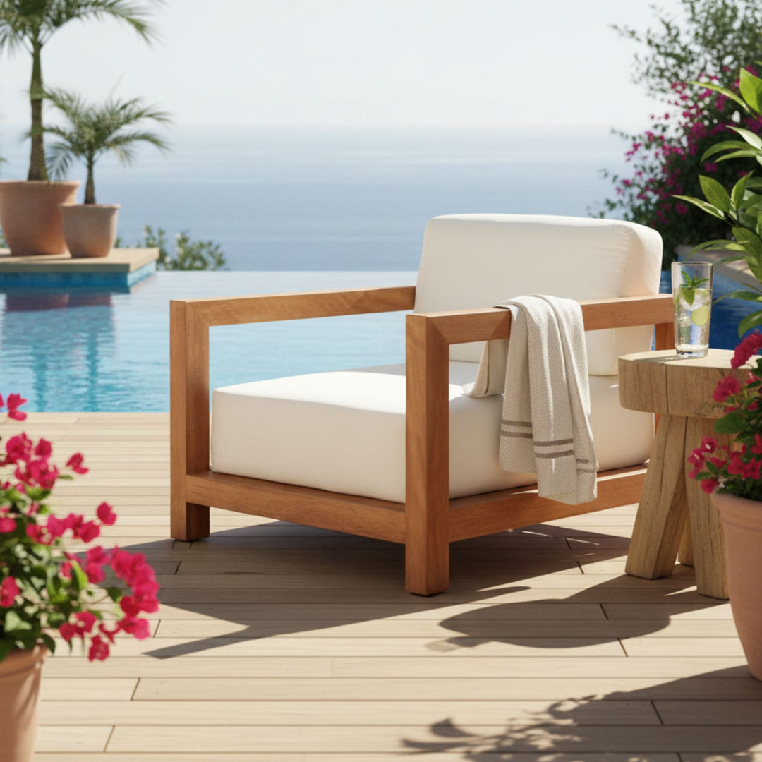 Santorini Solid Teak Sofa displayed on a terrace with ocean views.