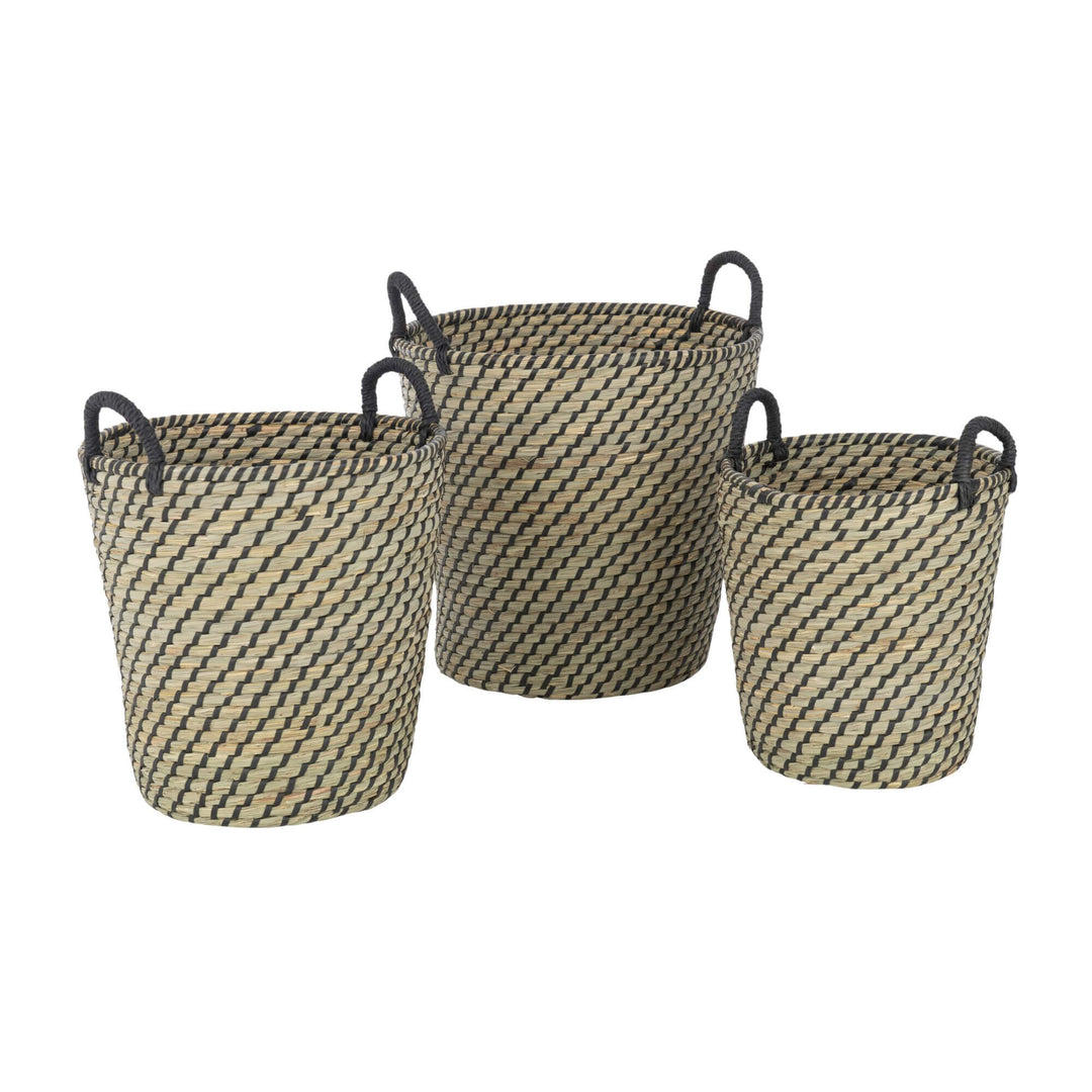 Set of three Sanur natural fiber baskets with handles.