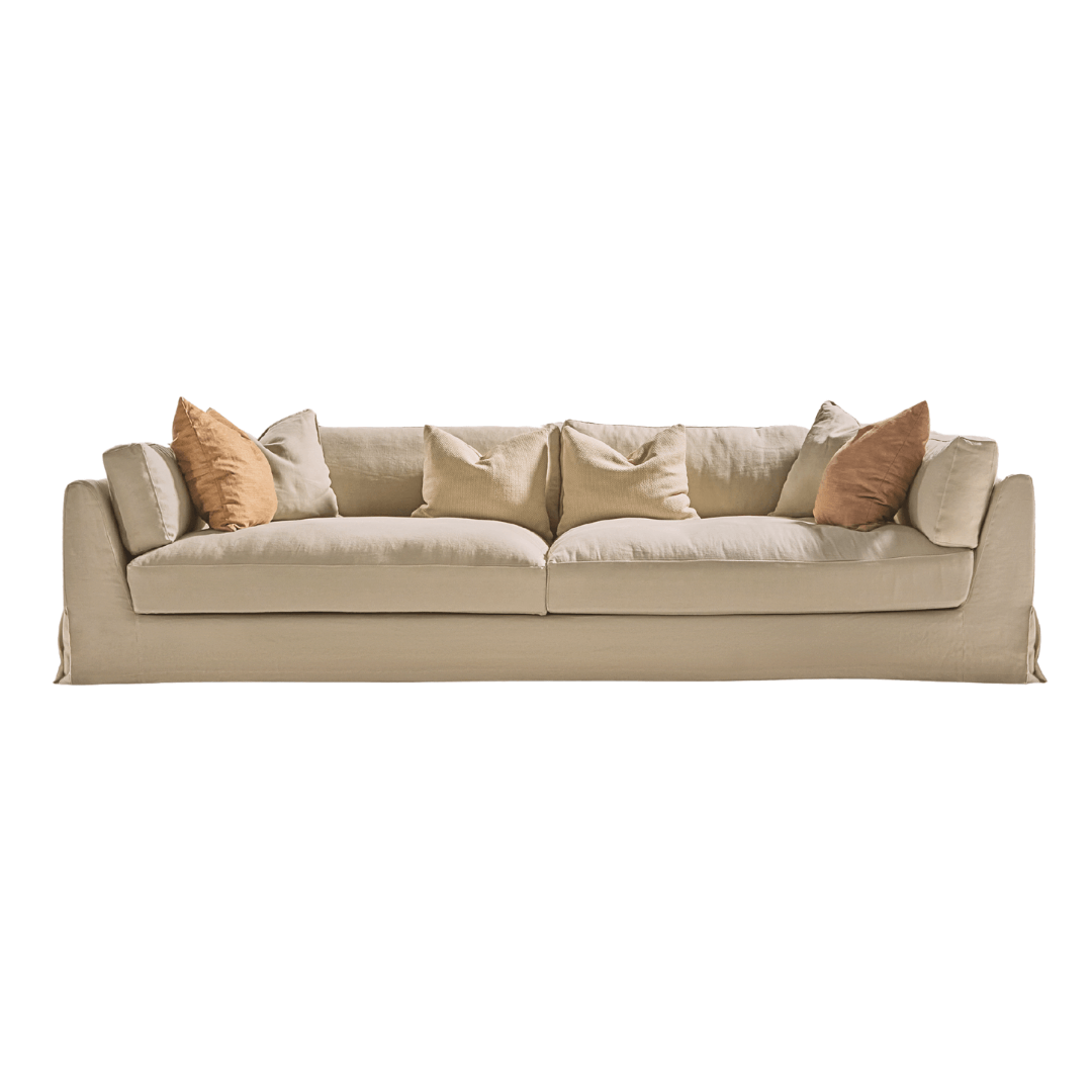 Sardegna sofa in sand tone with warm-colored cushions