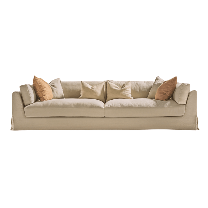 Sardegna sofa in sand tone with warm-colored cushions