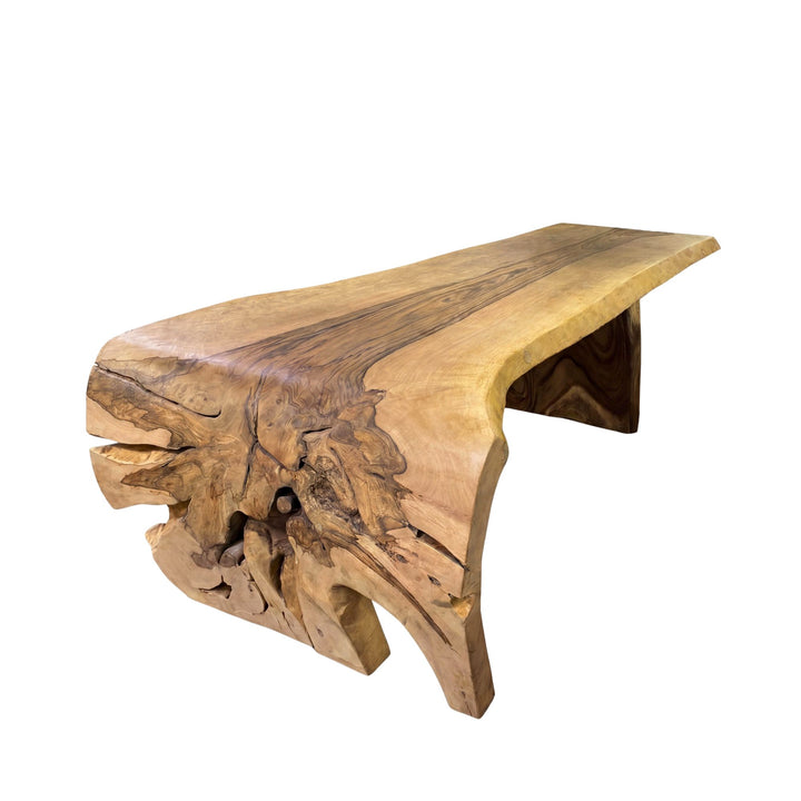 Front view of the Savara mango dining table showing its sculptural solid wood form and natural live-edge character.