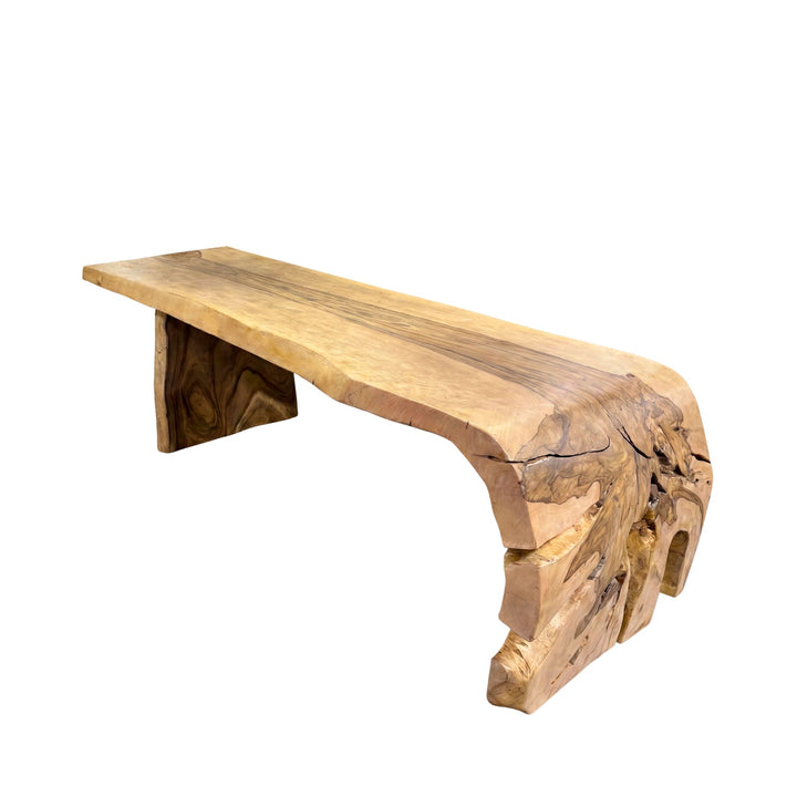 Front angled view of the dining table highlighting its bold base and handcrafted organic silhouette.