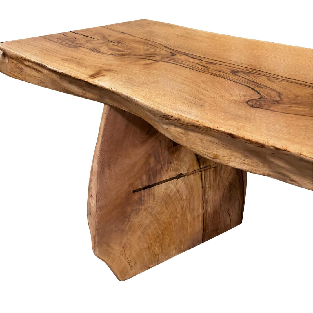 Close-up detail of the tabletop edge showing the rich mango wood grain and natural live-edge shape.