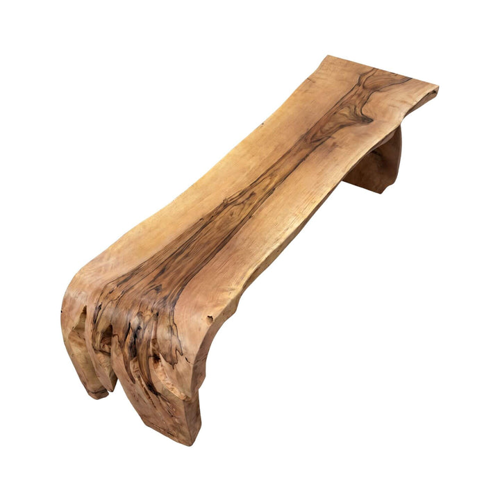 Top angled view of the dining table highlighting its bold base and handcrafted organic silhouette.