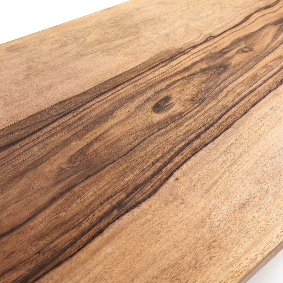 Close-up of the tabletop surface highlighting the flowing wood grain and warm natural tones.