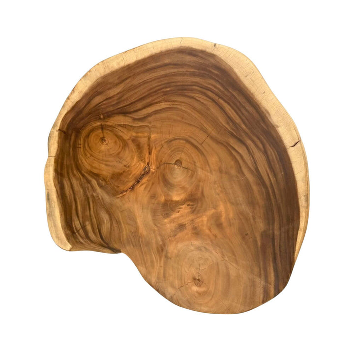 Top view of the coffee table highlighting the rich suar wood grain and sculptural form.