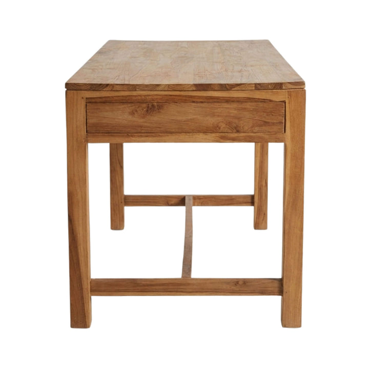 Side view of the Scheherazade Desk highlighting its clean lines and sturdy teak structure.