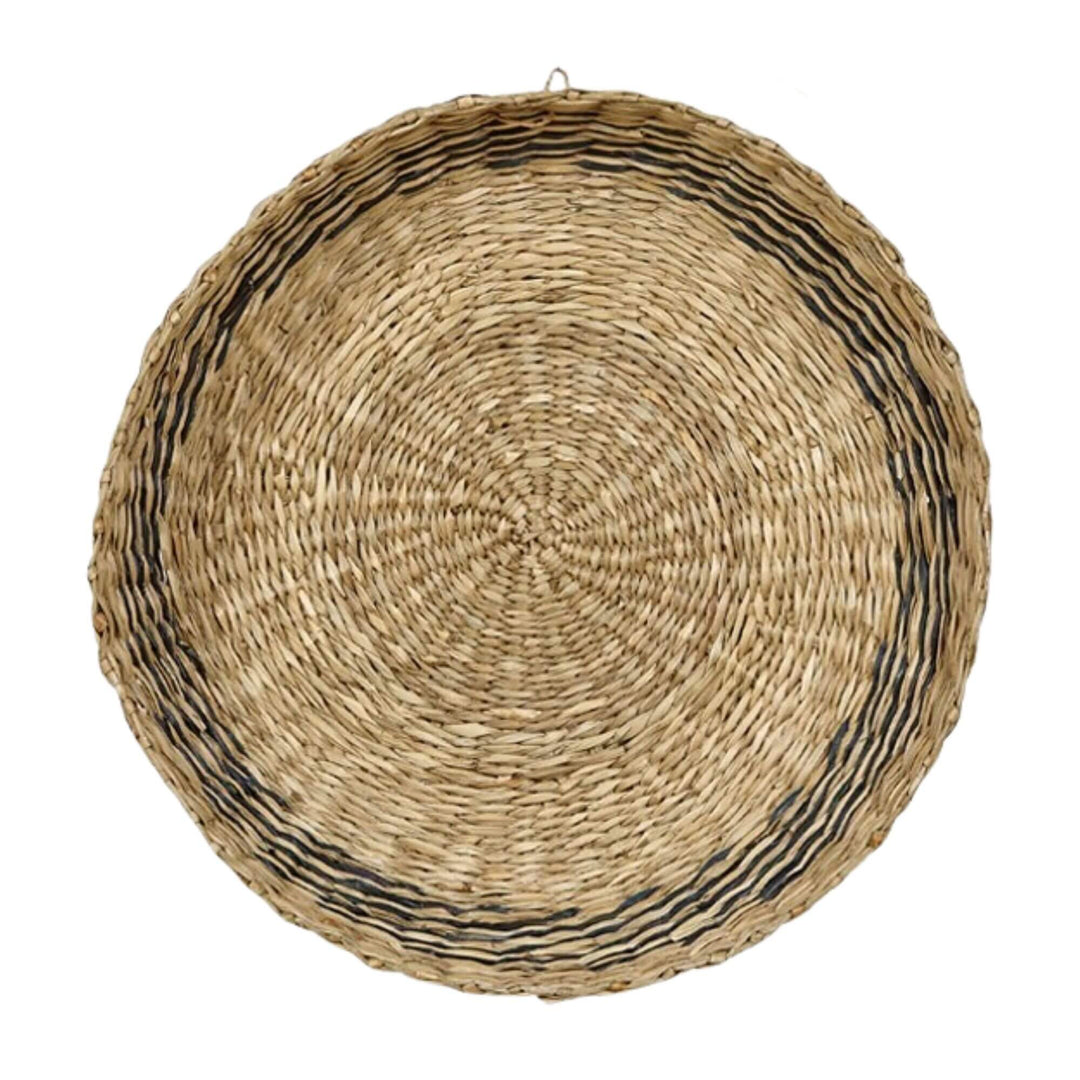 Top view of natural seagrass table basket with dark accent stripes
