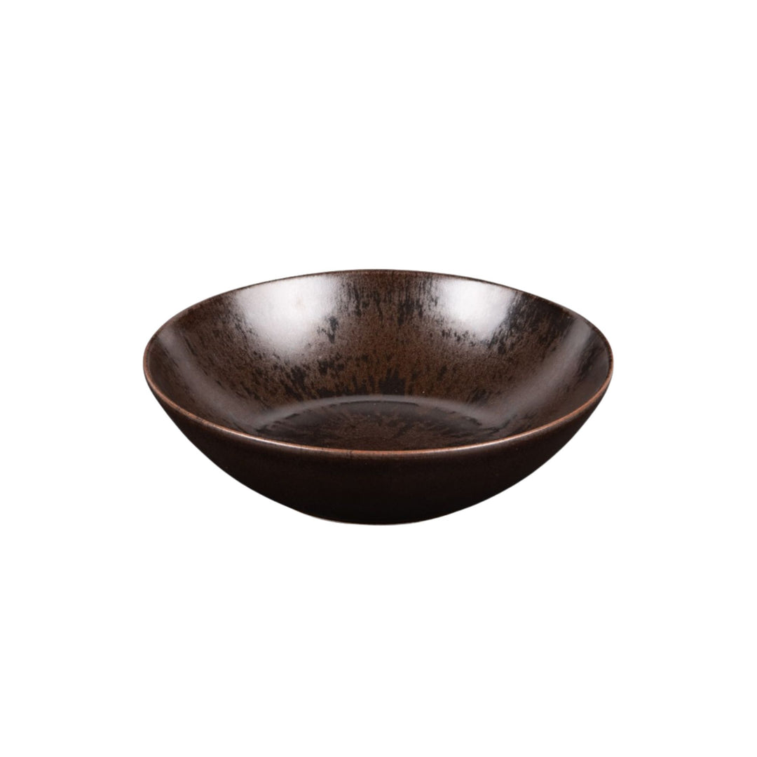 Ceramic small bowl from the Sebuku Brown collection showing organic shape and finish.