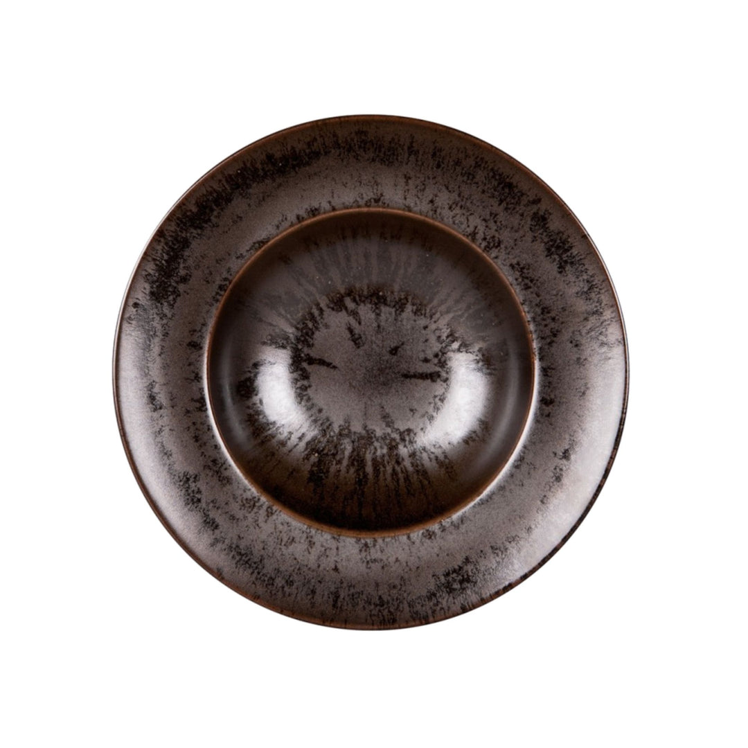 Top view of dark brown ceramic pasta plate with handcrafted glaze texture.