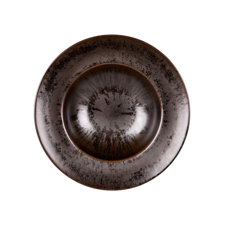Top view of dark brown ceramic pasta plate with handcrafted glaze texture.