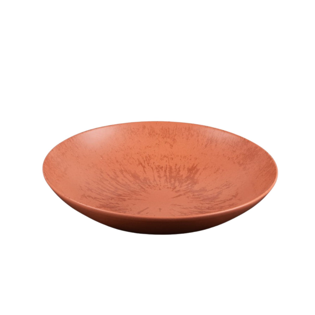 Ceramic bowl from the Sebuku Terra collection showing organic shape and glaze.