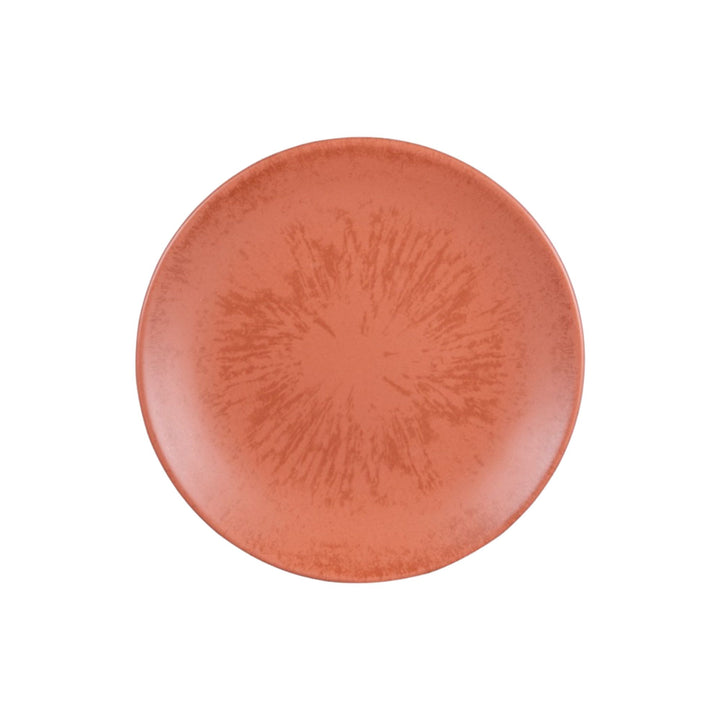 Top view of terracotta ceramic dessert plate with handcrafted surface texture.