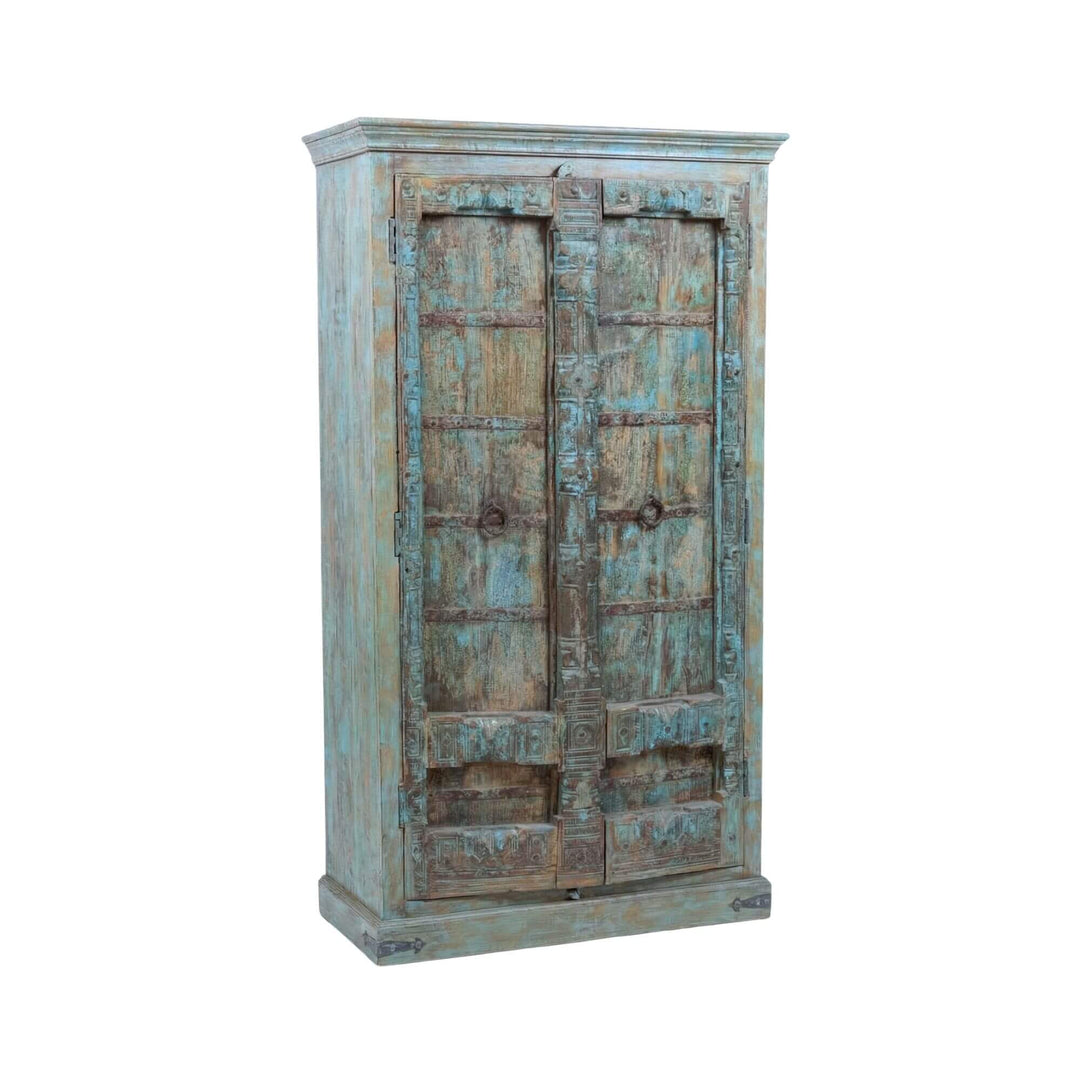 Front view of the Seidon wardrobe showing its distressed turquoise sheesham wood finish and carved double doors.