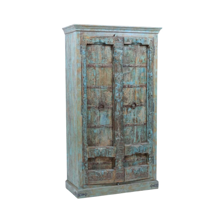 Front view of the Seidon wardrobe showing its distressed turquoise sheesham wood finish and carved double doors.