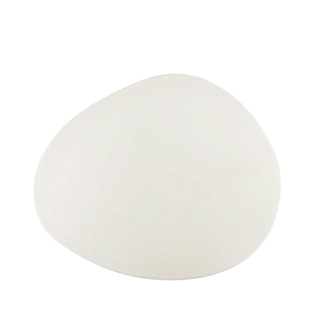 Angled view emphasizing the sculptural base and balanced proportions of the table.