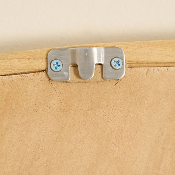 Close-up of the rear hanging system and solid wood construction of the mirror.