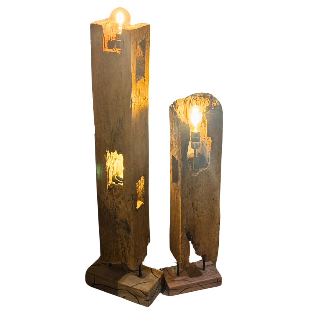 Pair of Sepik floor lamps in natural teak wood, small and large sizes with glowing bulbs.