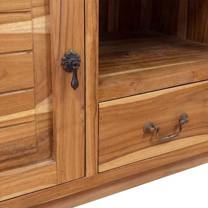 Close-up of the wooden cabinet door and handle detail.