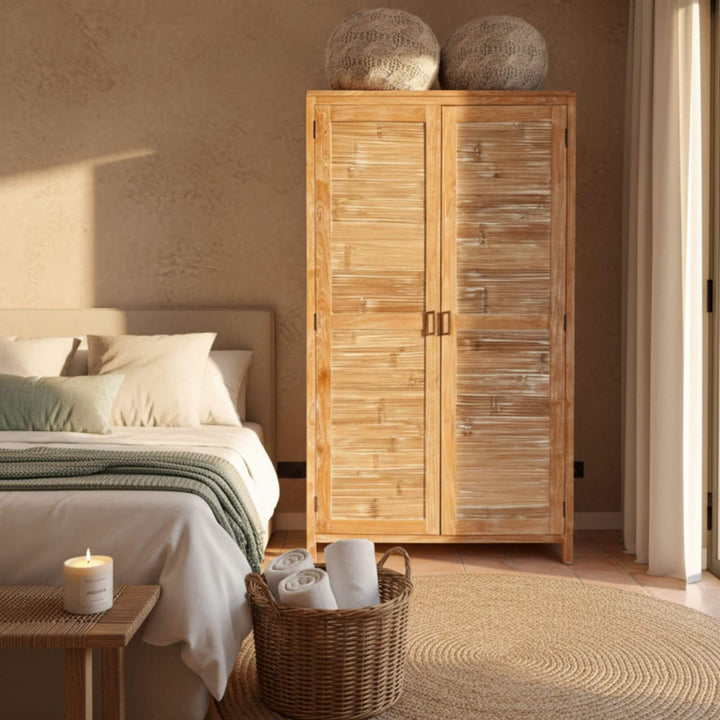 Bedroom setting featuring the Seychelles teak wardrobe as a focal point.