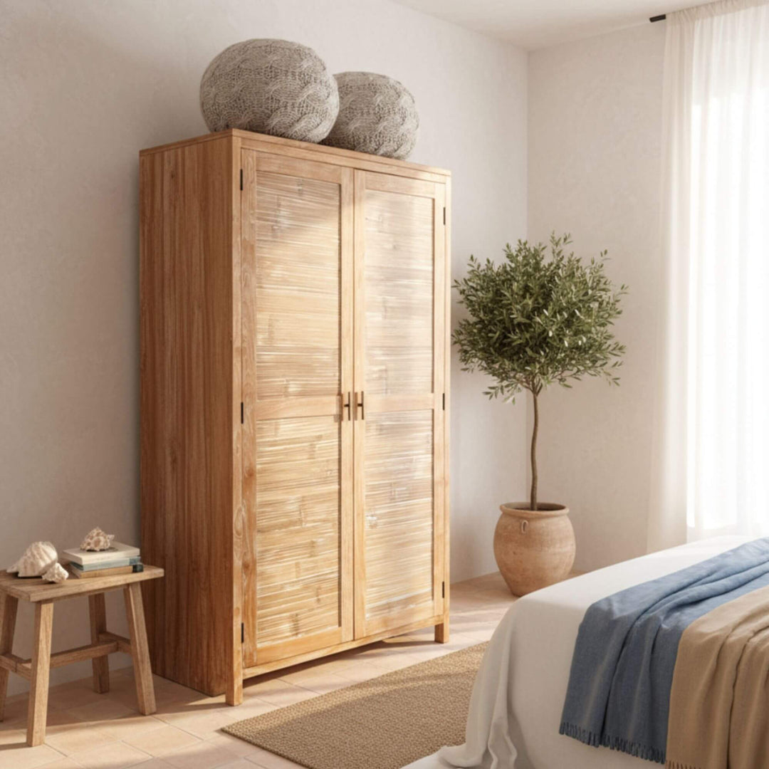 Bedroom setting featuring the Seychelles teak wardrobe as a focal point.