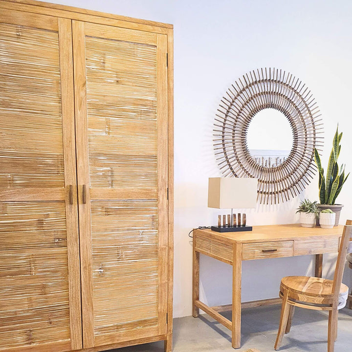Teak and bamboo wardrobe styled in a modern room beside a desk.