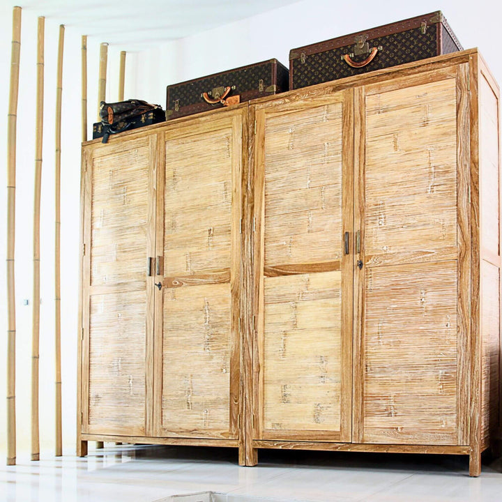 Row of Seychelles wardrobes in natural teak finish in interior setting.