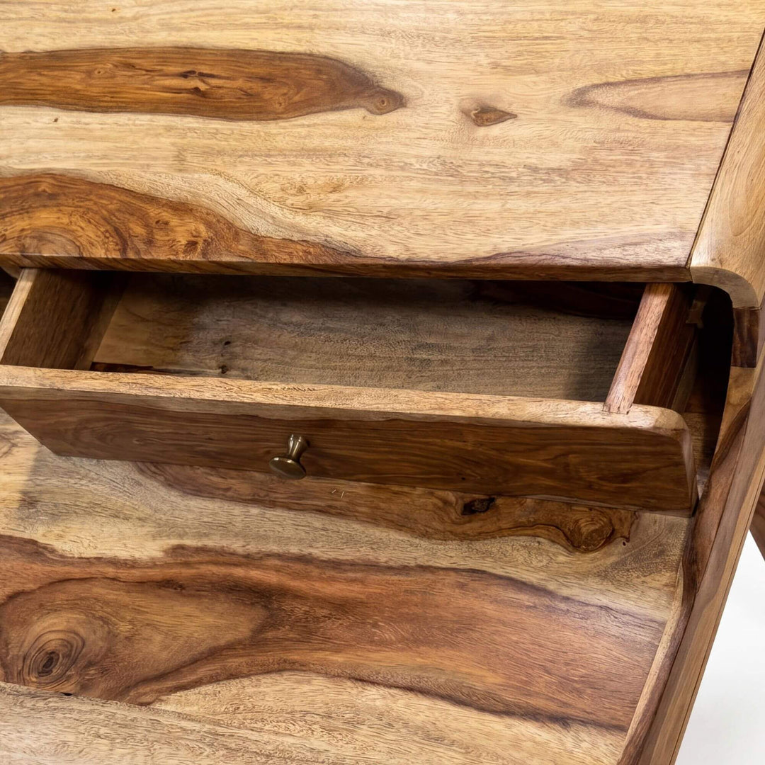 Close-up detail of the open drawer showing the rich sheesham wood grain and storage space.