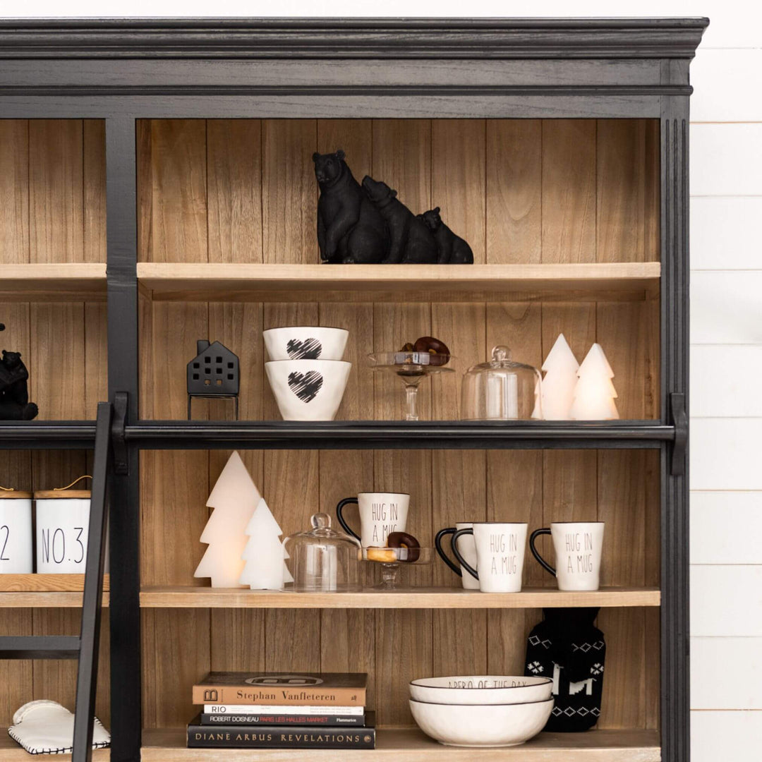 Styled living room wall with Sherlock rack filled with décor