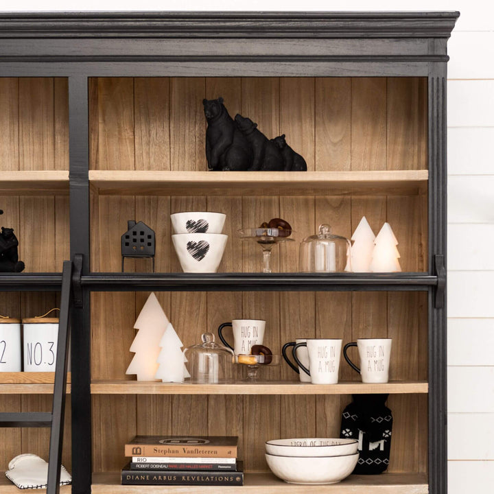 Styled living room wall with Sherlock rack filled with décor