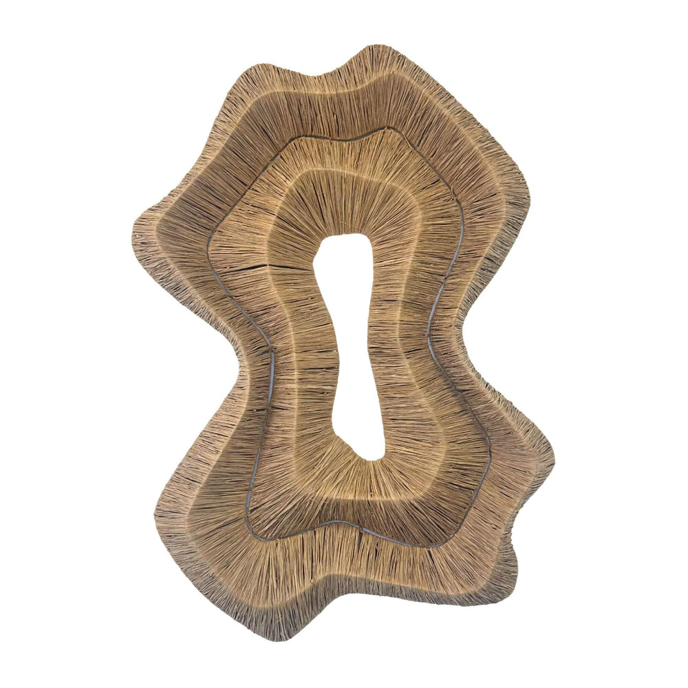 Handmade agel and natural fiber wall decoration with flowing silhouette