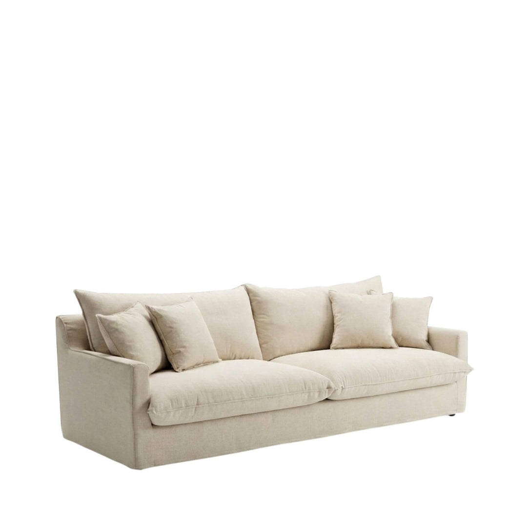 Angled view of the Sicilia sofa showcasing its relaxed silhouette and upholstered cushions.