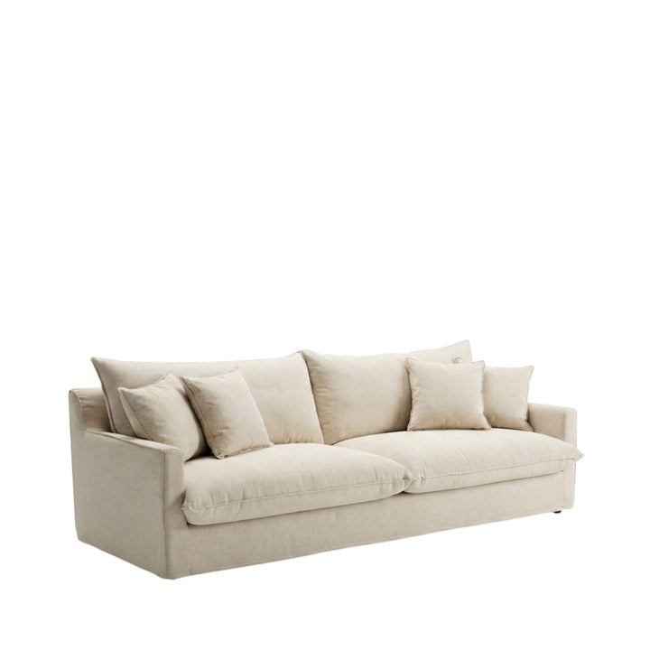 Angled view of the Sicilia sofa showcasing its relaxed silhouette and upholstered cushions.