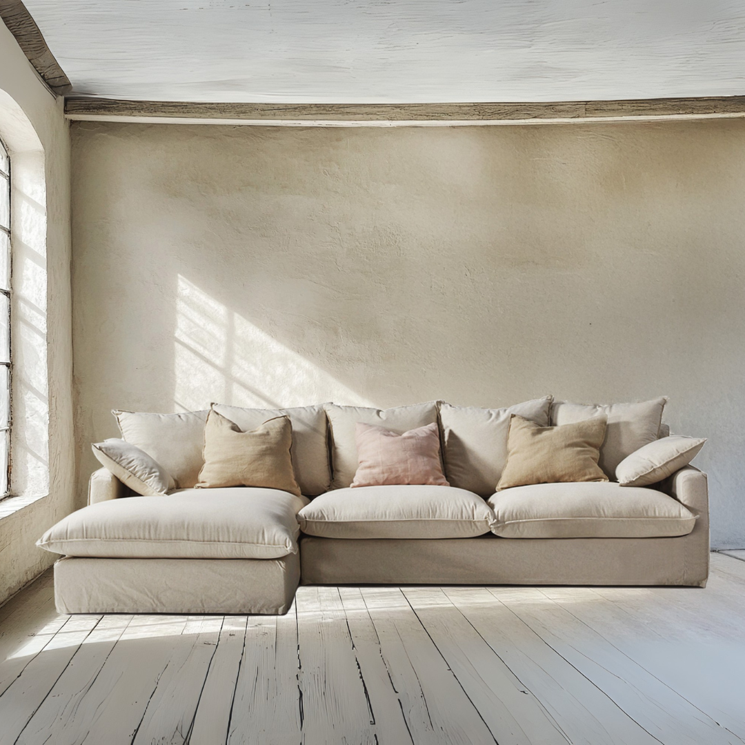 Sicilia Sofa with chaise longue in natural cotton-linen upholstery in a bright living room.