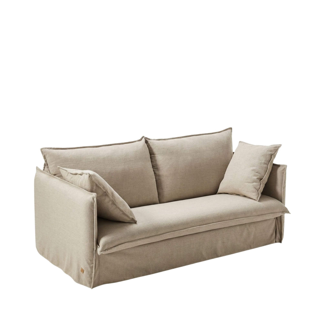 Angled view of the Sicilia sofa bed in sofa position, showcasing its clean lines and upholstered design.