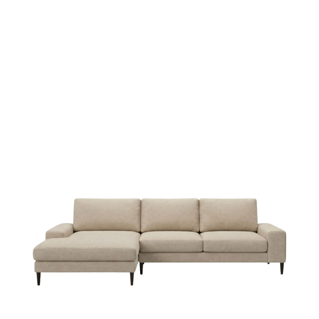 Front view of the Siena sofa in light neutral upholstery with chaise extension.