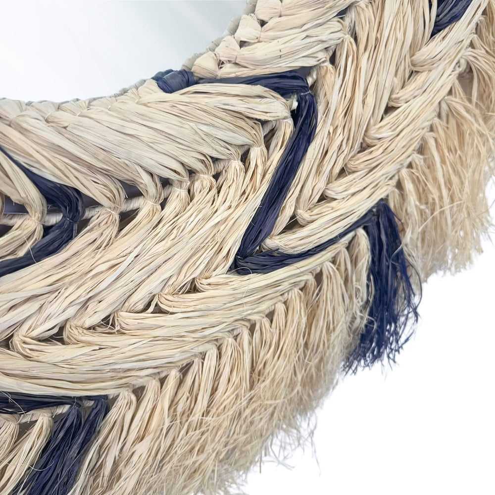 Close-up of natural sisal weave with dark accents on mirror frame
