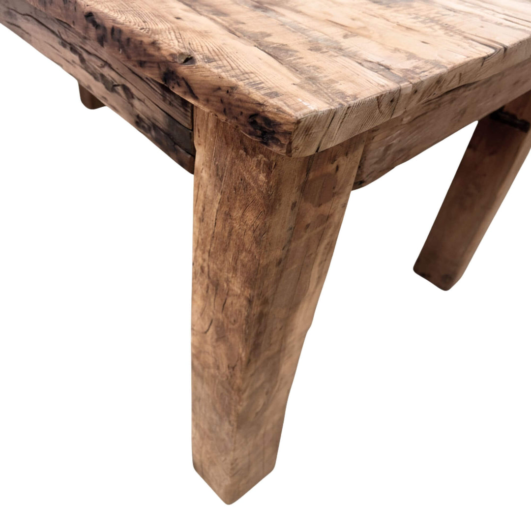 Close-up of a rustic Sleeper rail train table with a white background