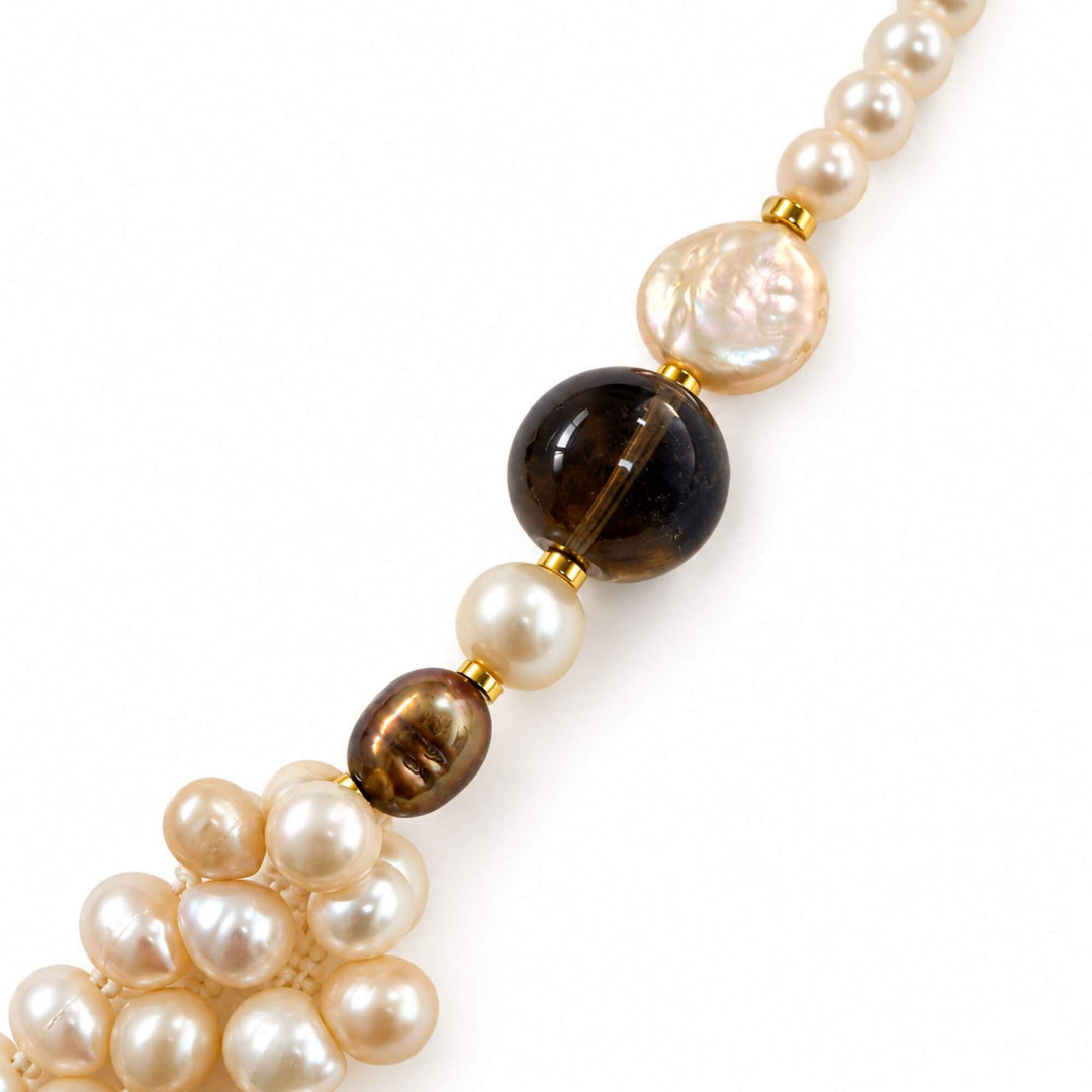 Close-up of round pearls, smoky quartz and natural pearl textures