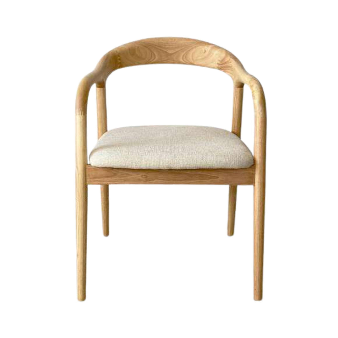 Front view of the chair highlighting its rounded backrest, arm detail, and upholstered seat.