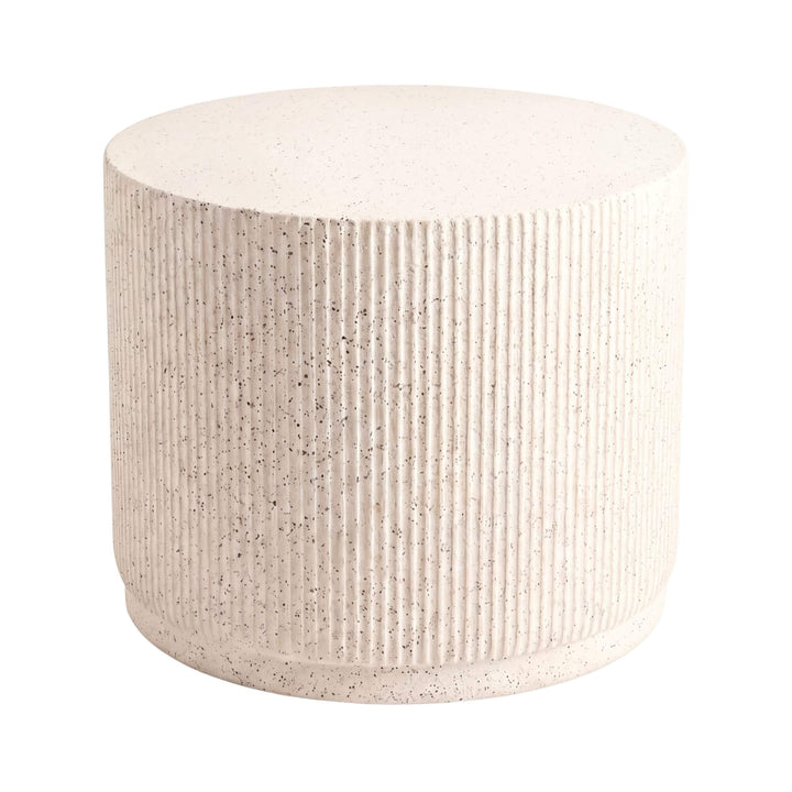 Front view of the stone look outdoor coffee table showing its rounded cylindrical shape and textured finish.