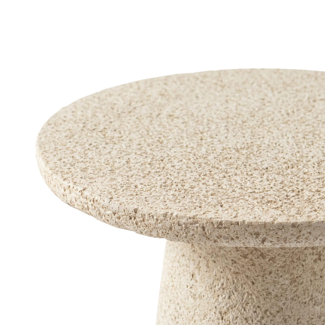 Close-up of the Stone Look side table highlighting its textured mineral-style surface and rounded edge