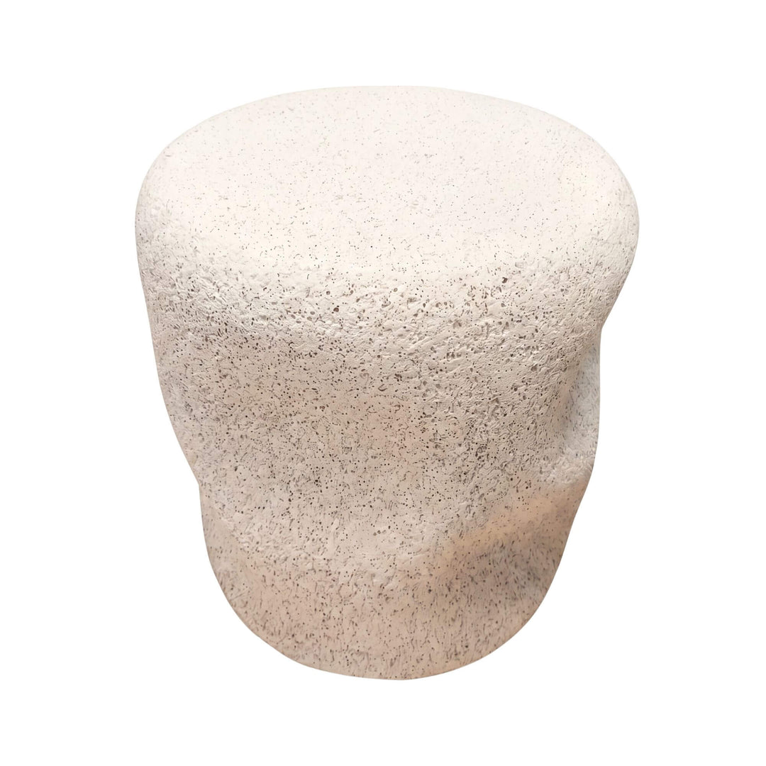 Front view of the stone look outdoor stool showing its sculptural organic shape and textured finish.