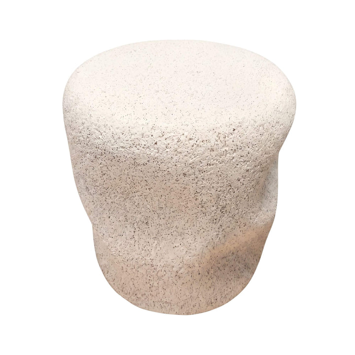 Front view of the stone look outdoor stool showing its sculptural organic shape and textured finish.