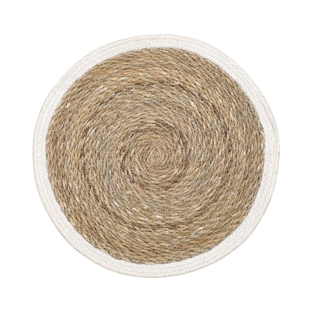 Top view of the straw table mat showing its circular handwoven design and natural texture.