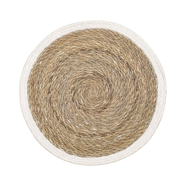 Top view of the straw table mat showing its circular handwoven design and natural texture.