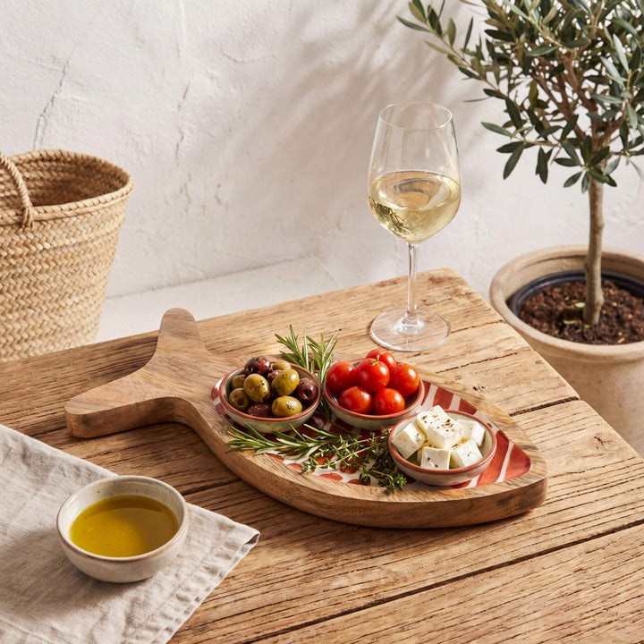 Styled dining setting with the striped fish tray used as a decorative serving piece.